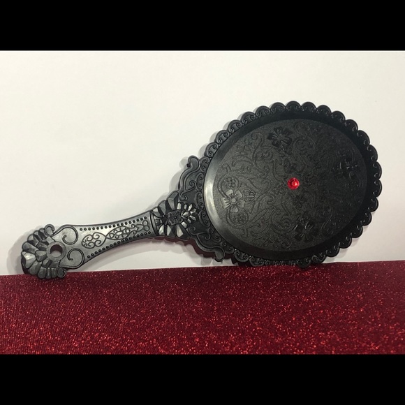 Handheld mirror - Picture 1 of 2